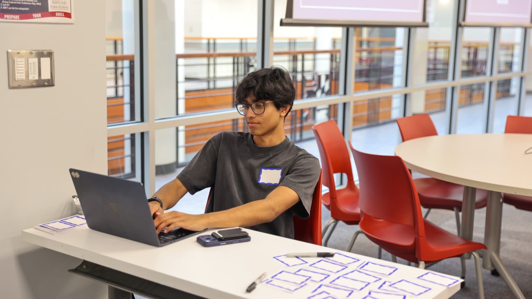 A DVCG analyst working at a laptop