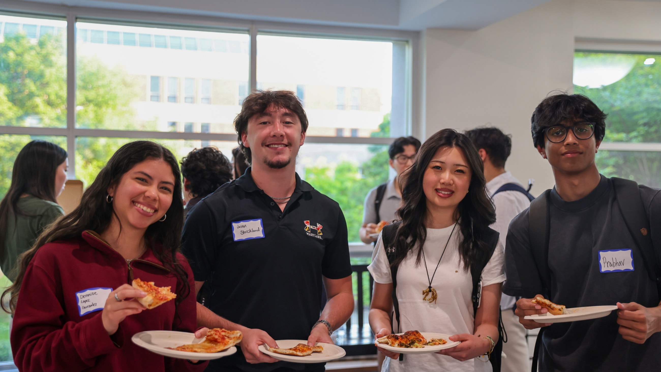 DVCG members talking over plates of food at an event