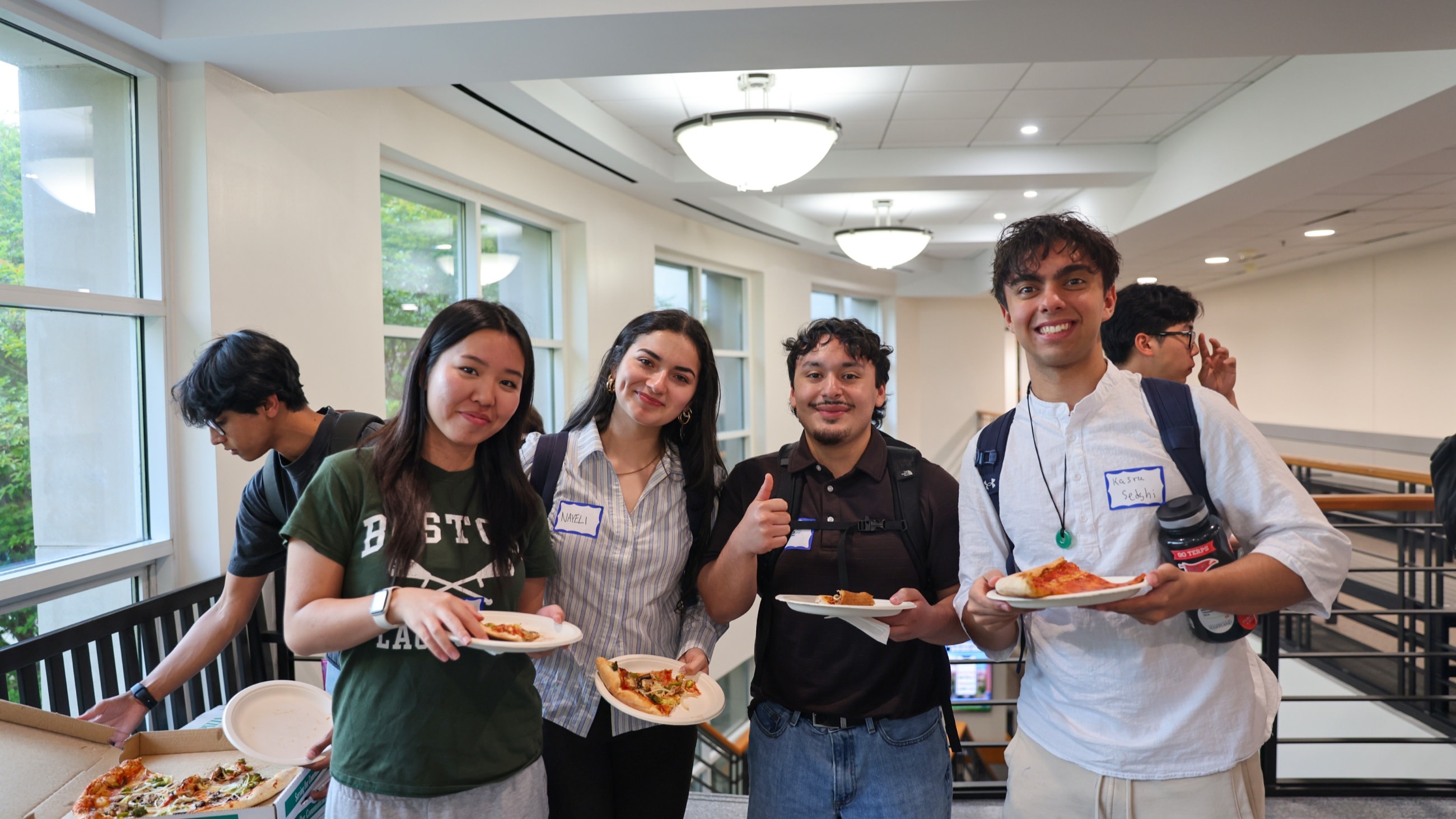 DVCG members with plates of food, mid-conversation at an event