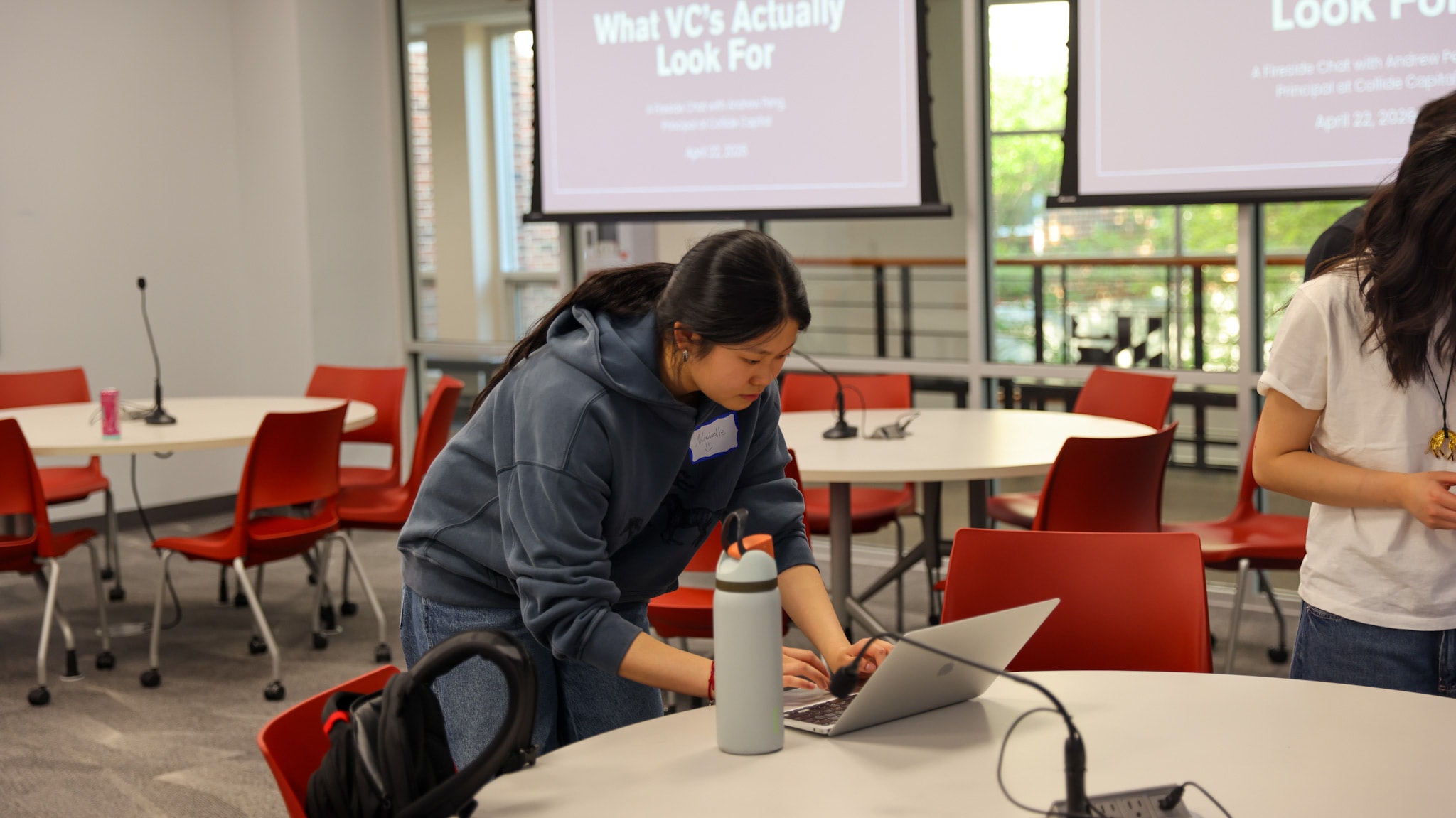 A DVCG member working over a laptop during a session